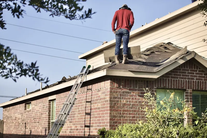 Professional roofer working on a residential roof in North Evanston
